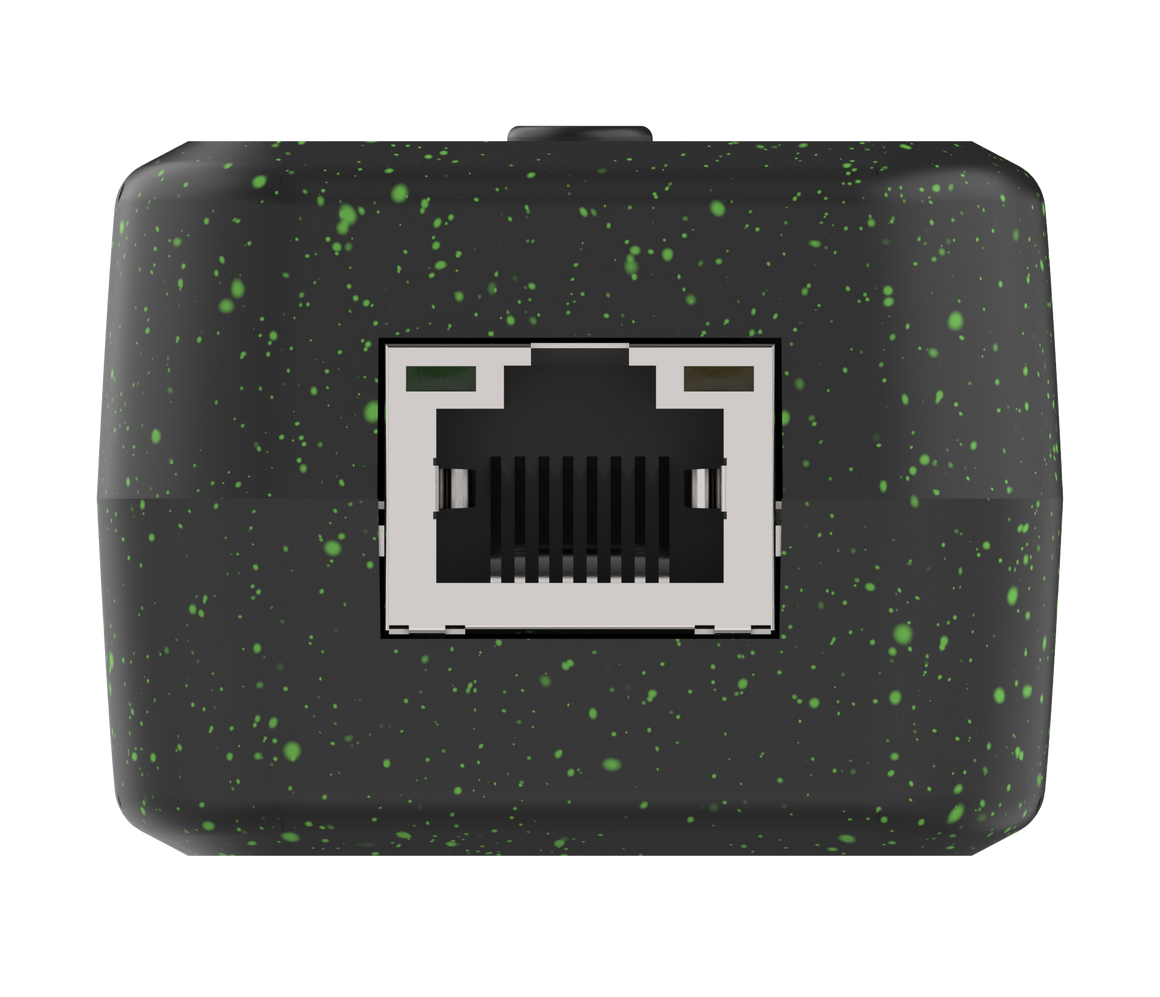 Black electronic module with green speckles and an Ethernet port on a white background