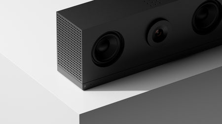 Huddly C1 Black speaker on a white surface